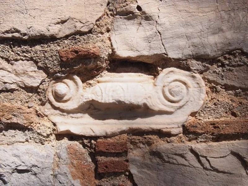 Ionic pillar capital embedded in wall of St.Peter's Church, Kalyvia Thorikou, Greece.
