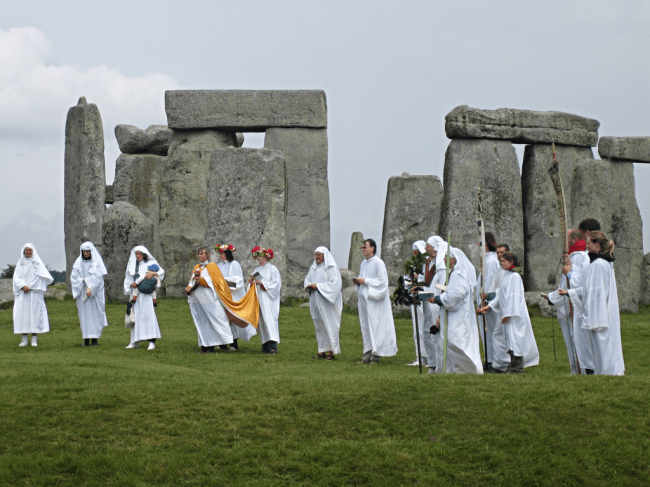 Modern Druids celebrating at Stonehenge in England. Modern Druids celebrating at Stonehenge in England.